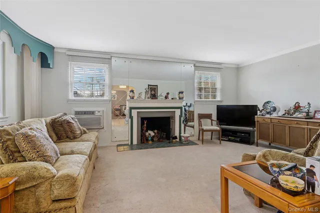 a view of a livingroom with furniture and stairs