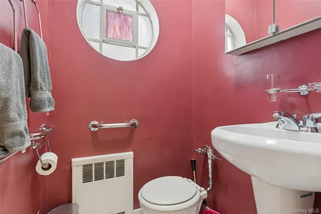 a bedroom with a bed and a chair