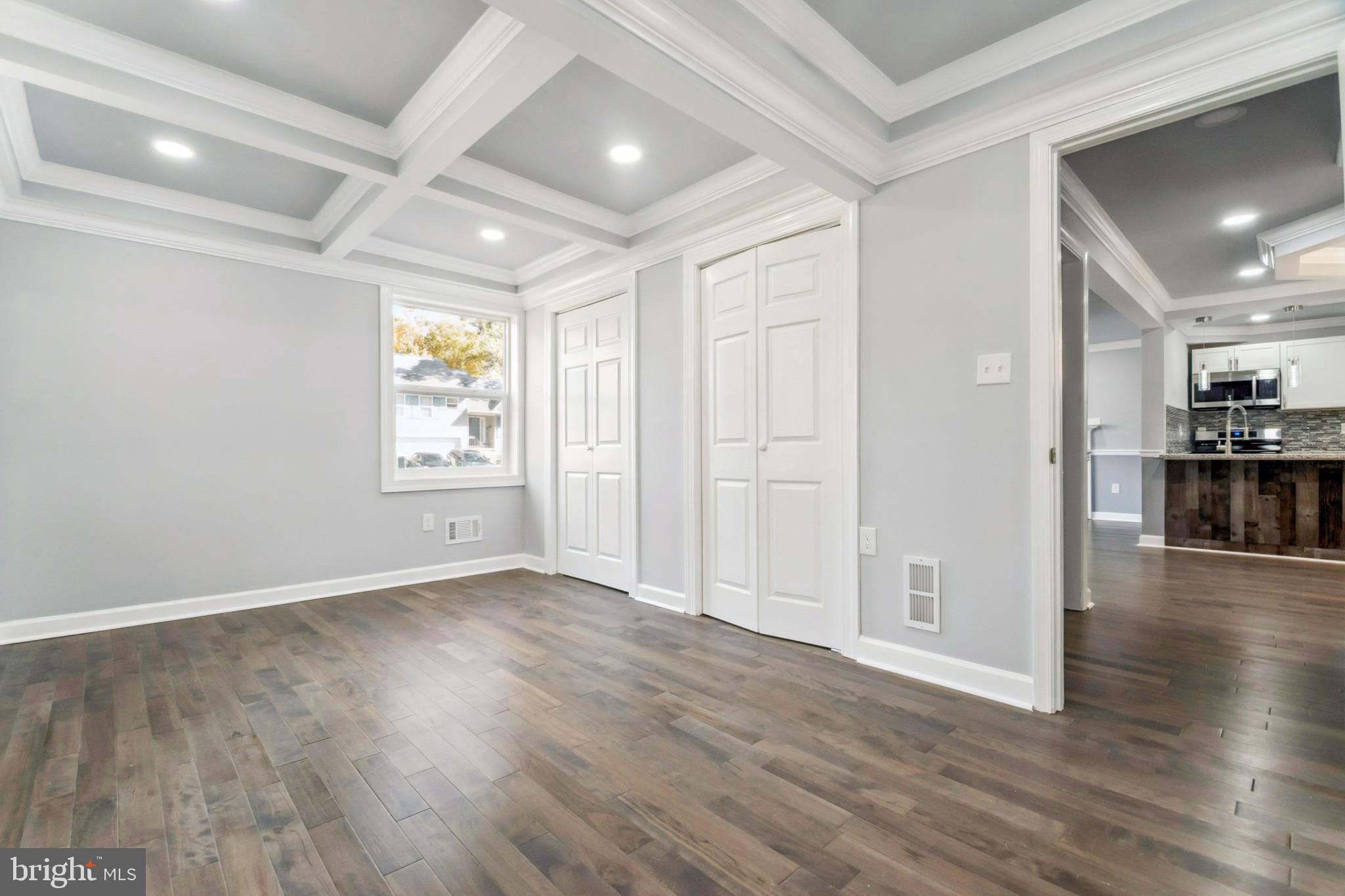6804 Carol Road Baltimore, MD 21207 - Photo 9 of 25 wooden floor in an empty room with a window