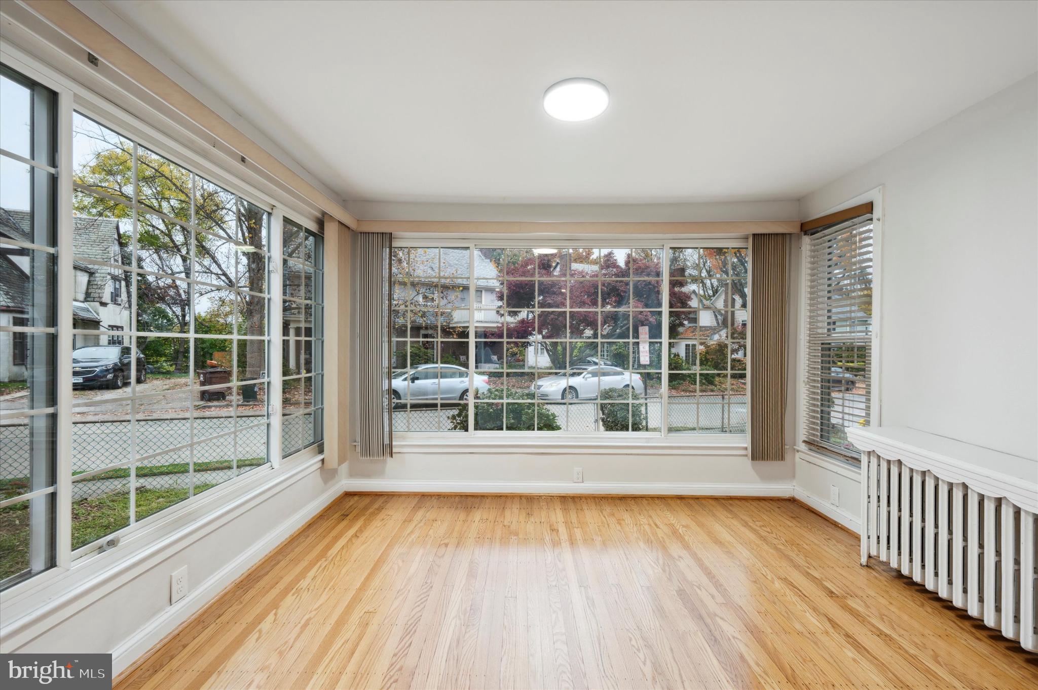 124 Walsh Road Lansdowne, PA 19050 - Photo 8 of 30 a view of a room with wooden floor and city view