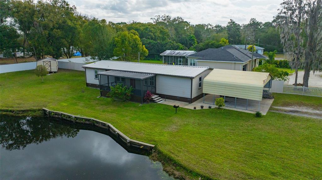 15615 Willowdale Road Tampa, FL 33625 - Photo 1 of 39 an aerial view of a house with swimming pool garden and patio