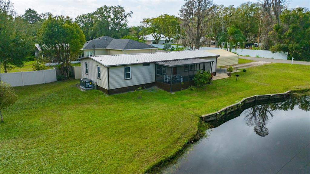 15615 Willowdale Road Tampa, FL 33625 - Photo 11 of 39 an aerial view of a house with swimming pool garden and patio