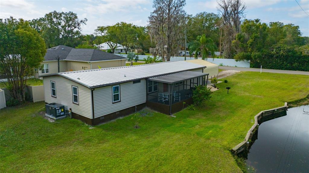 15615 Willowdale Road Tampa, FL 33625 - Photo 12 of 39 a view of a house with a big yard and large trees