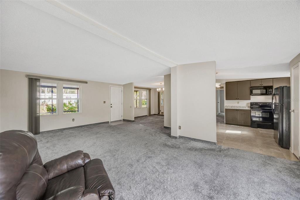 15615 Willowdale Road Tampa, FL 33625 - Photo 15 of 39 a view of livingroom with furniture and windows