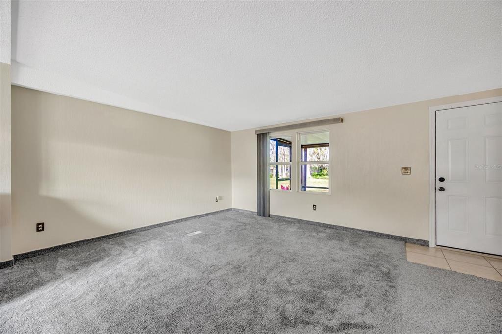 15615 Willowdale Road Tampa, FL 33625 - Photo 16 of 39 a view of an empty room with a window