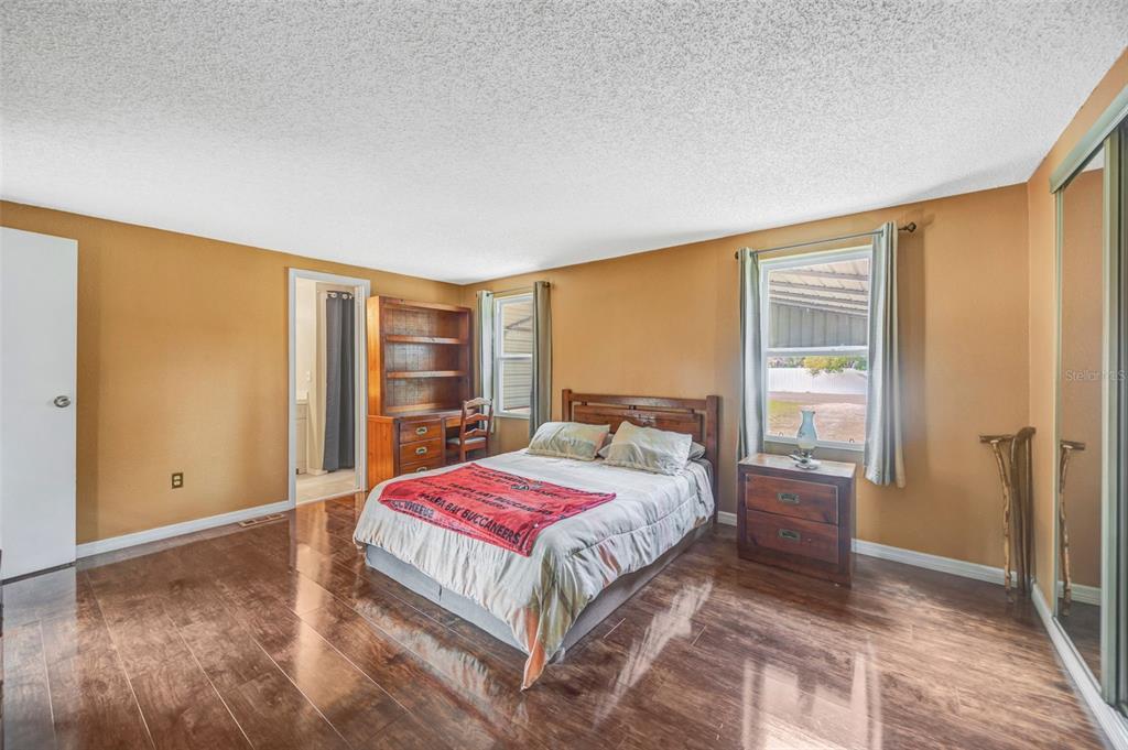 15615 Willowdale Road Tampa, FL 33625 - Photo 27 of 39 a bedroom with a bed and a window