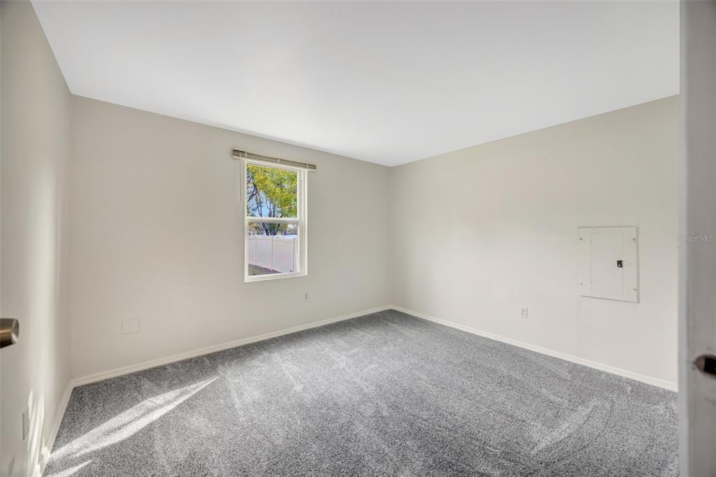 15615 Willowdale Road Tampa, FL 33625 - Photo 29 of 39 an empty room with windows