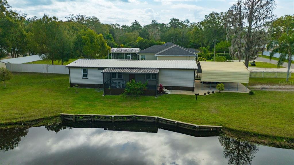 15615 Willowdale Road Tampa, FL 33625 - Photo 6 of 39 an aerial view of a house with a garden and swimming pool