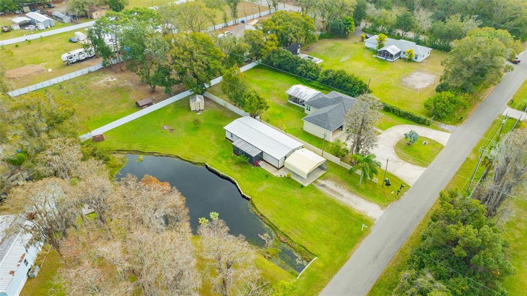 15615 Willowdale Road Tampa, FL 33625 - Photo 10 of 39 an aerial view of a swimming pool with a yard