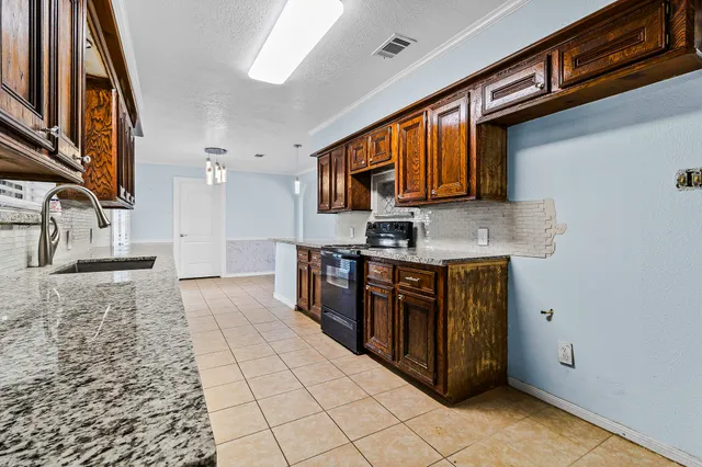 a view of a hallway with wooden floor and closet