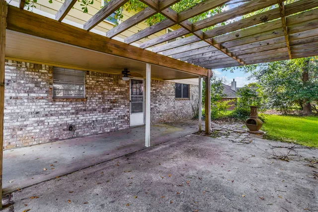 a view of a backyard with wooden fence