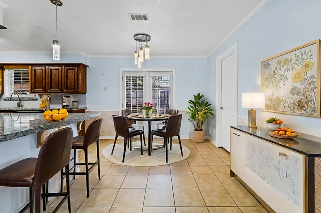 a kitchen with stainless steel appliances granite countertop a sink and a stove