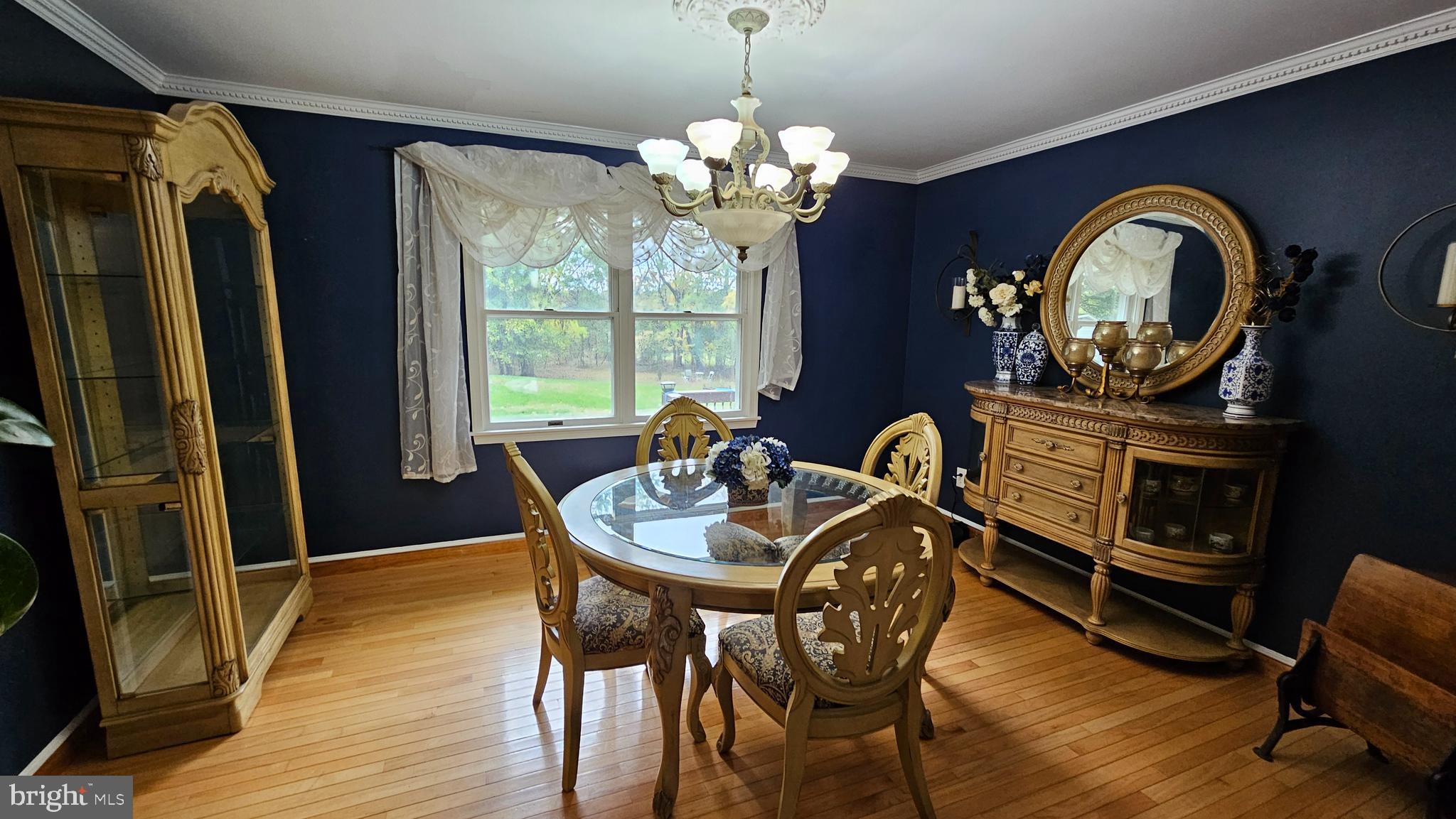 90 Knoxlyn-Orrtanna Road Gettysburg, PA 17325 - Photo 11 of 32 a dining room with furniture a chandelier and wooden floor