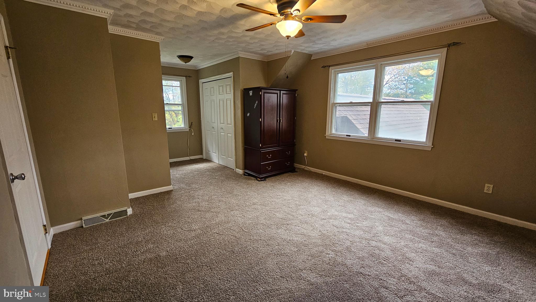 90 Knoxlyn-Orrtanna Road Gettysburg, PA 17325 - Photo 21 of 32 an empty room with windows and fan