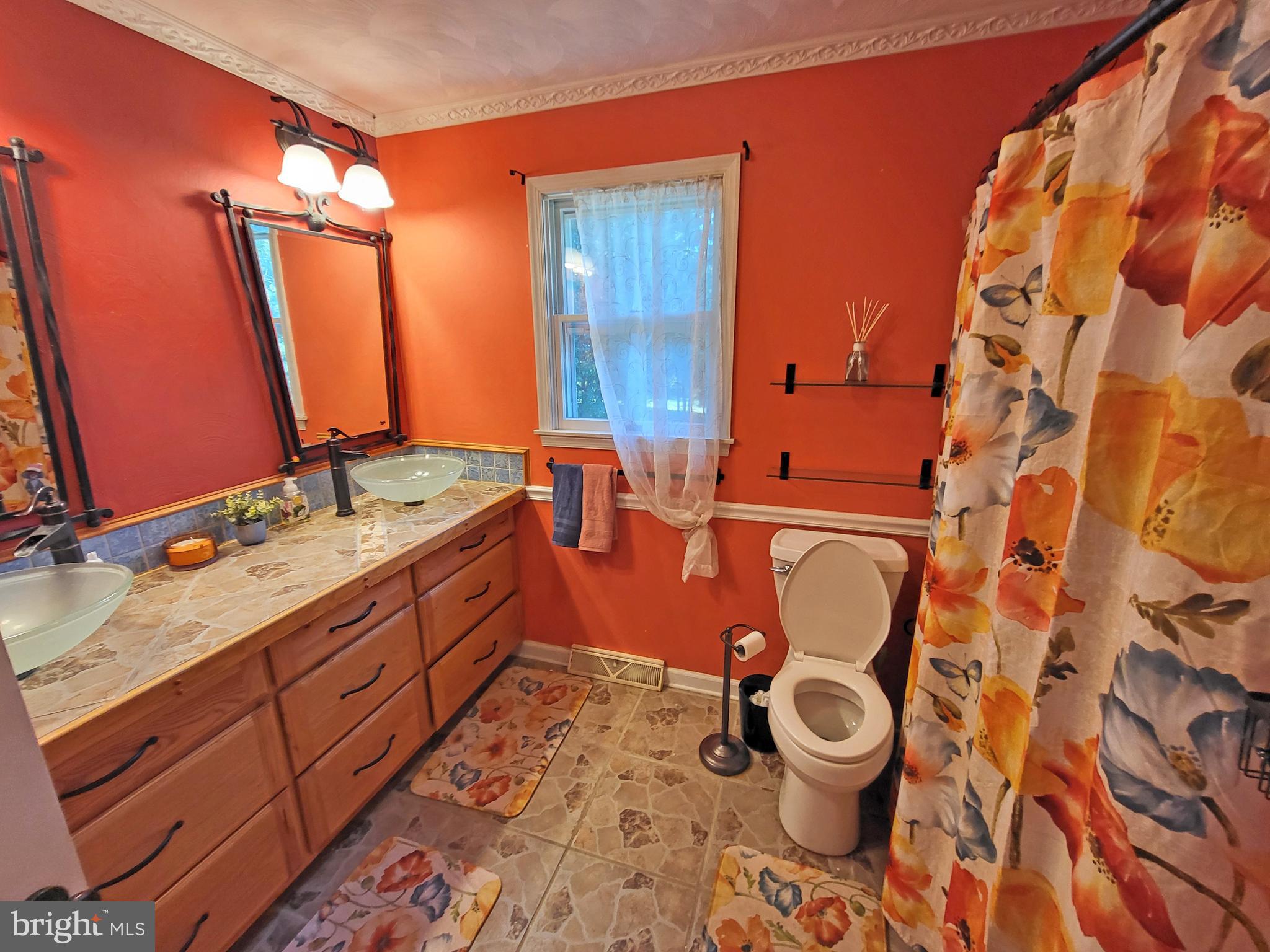 90 Knoxlyn-Orrtanna Road Gettysburg, PA 17325 - Photo 22 of 32 a bathroom with a sink and a mirror