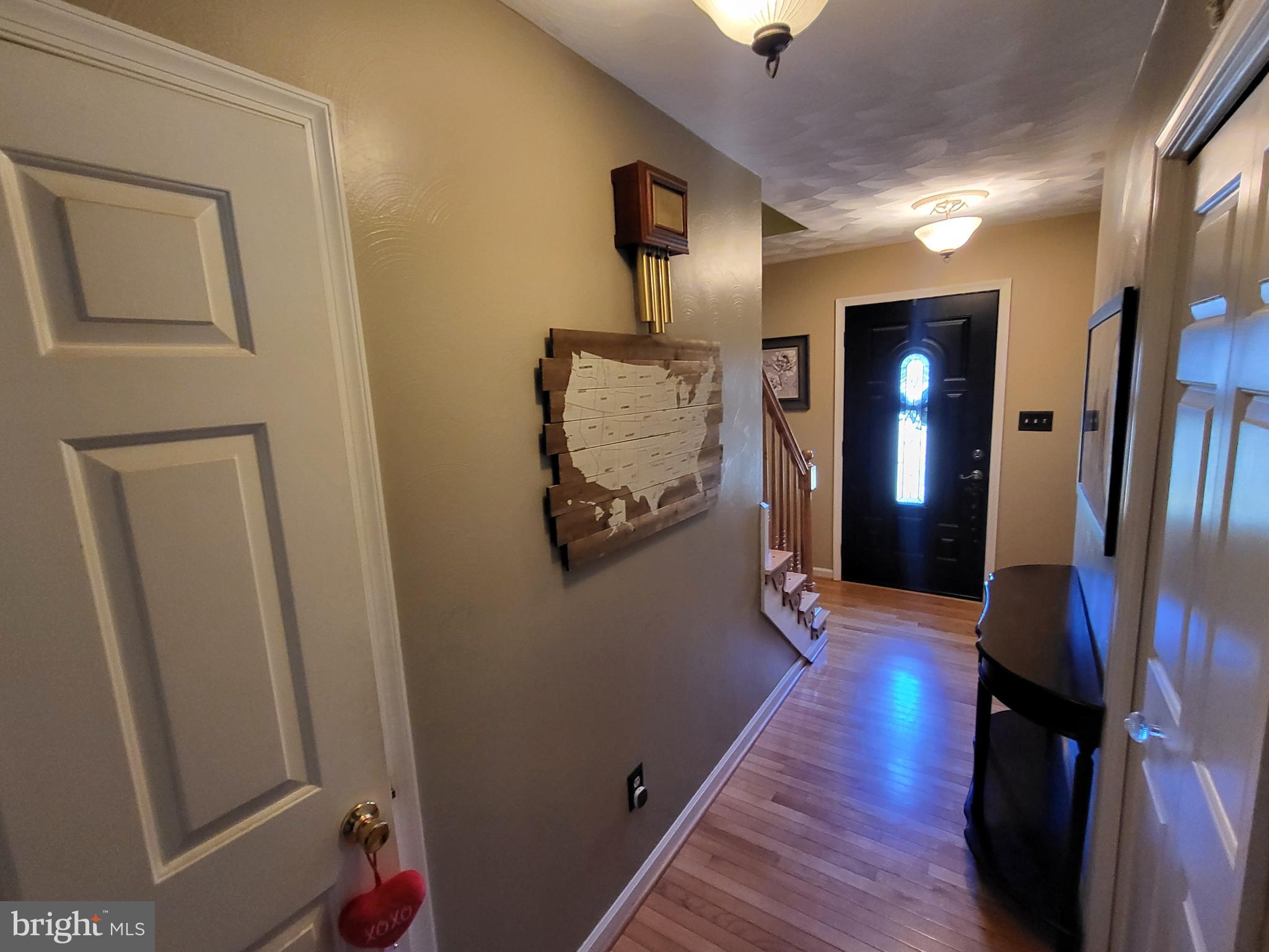 90 Knoxlyn-Orrtanna Road Gettysburg, PA 17325 - Photo 6 of 32 a view of a hallway with wooden floor and stairs
