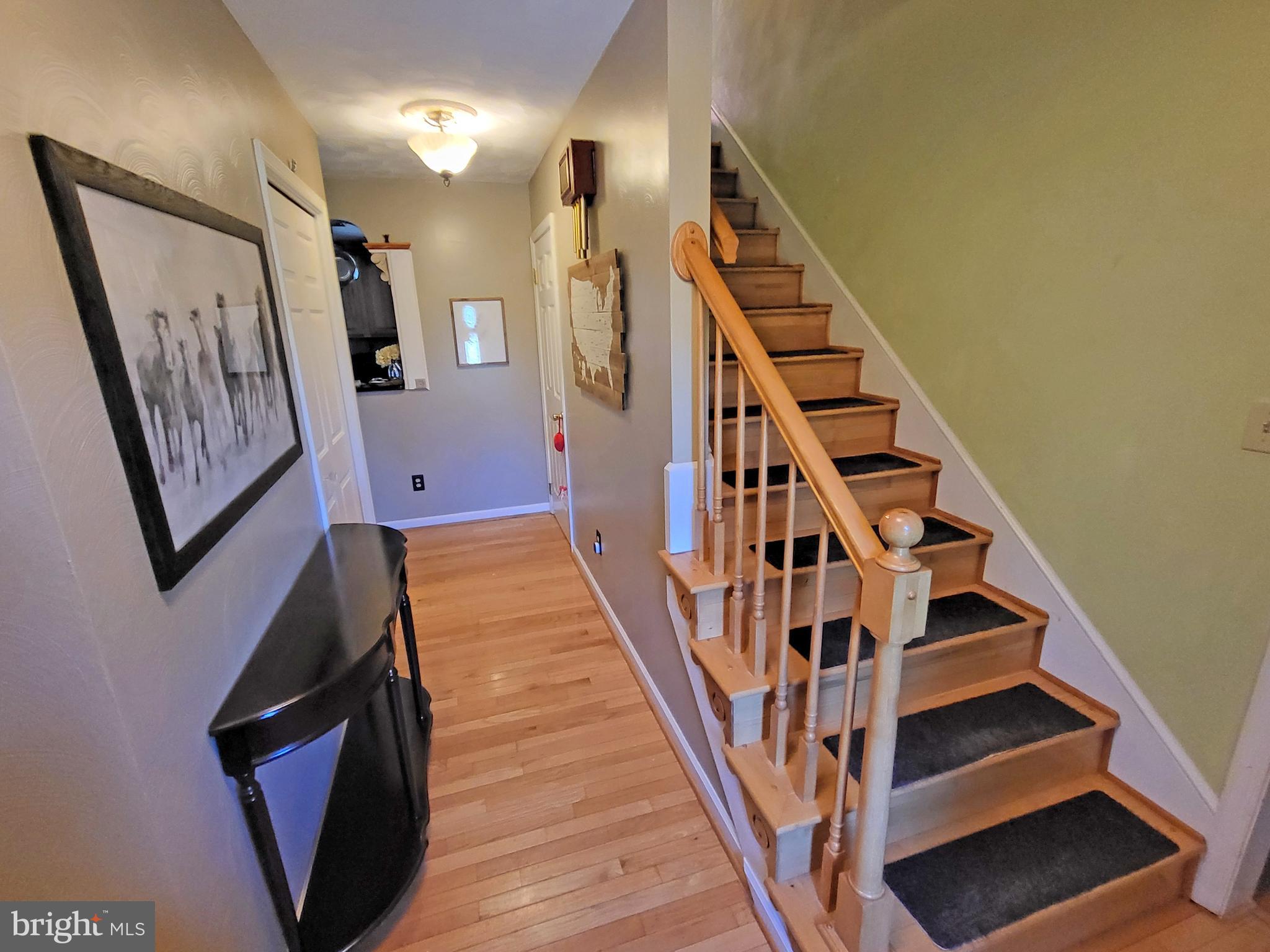 90 Knoxlyn-Orrtanna Road Gettysburg, PA 17325 - Photo 7 of 32 a view of staircase with lots of frames on wall and a window