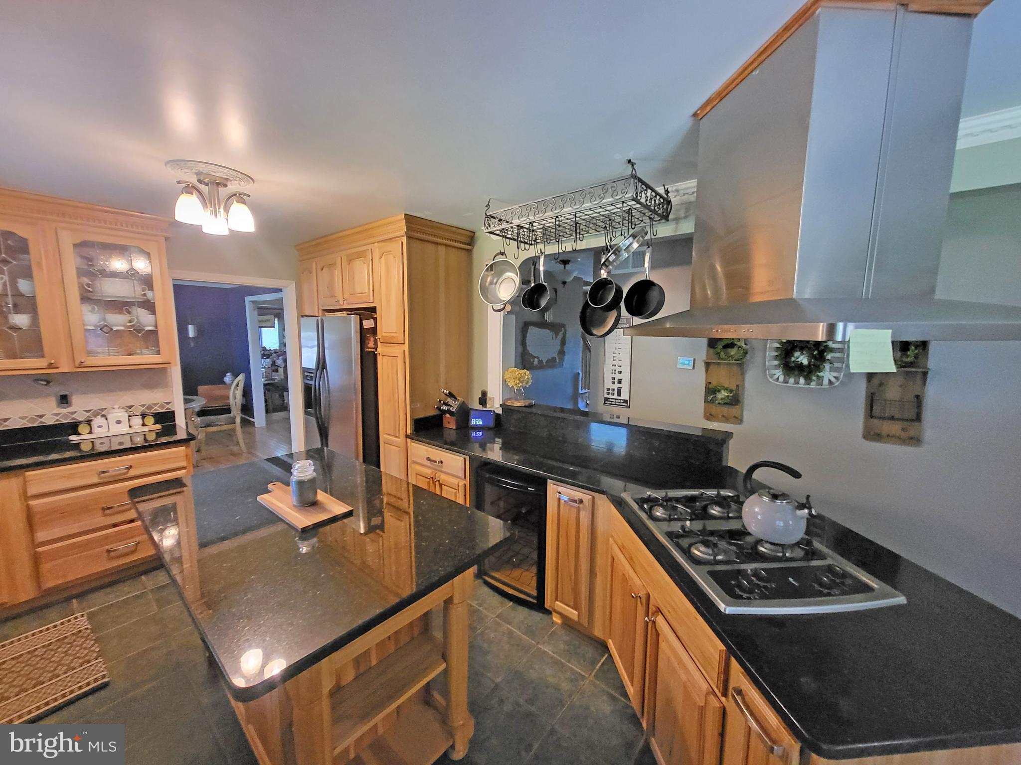 90 Knoxlyn-Orrtanna Road Gettysburg, PA 17325 - Photo 10 of 32 a kitchen with stainless steel appliances granite countertop a stove refrigerator and cabinets