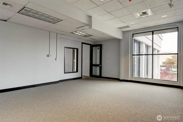 a bathroom with a sink toilet and mirror