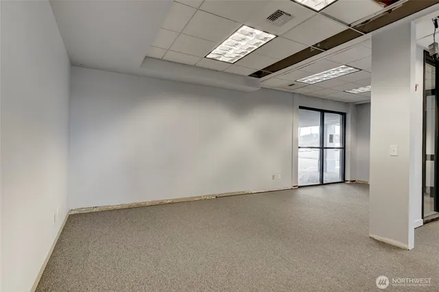 a view of an empty room with stairs