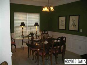 875 Knightsbridge Road Fort Mill, SC 29708 - Photo 3 of 8 a view of a dining room with furniture and chandelier