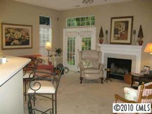 875 Knightsbridge Road Fort Mill, SC 29708 - Photo 4 of 8 a living room with furniture a window and a fireplace