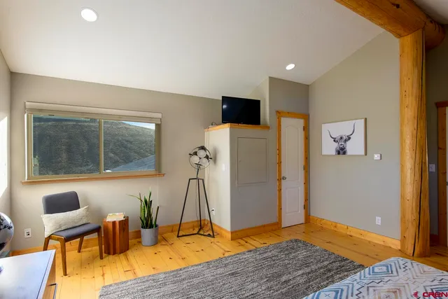 a view of kitchen with furniture and wooden floor