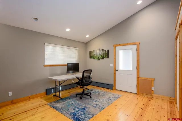 a workspace with furniture and a window