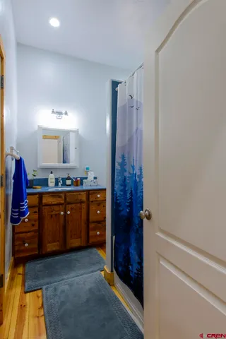 a spacious bathroom with a double vanity sink and a mirror