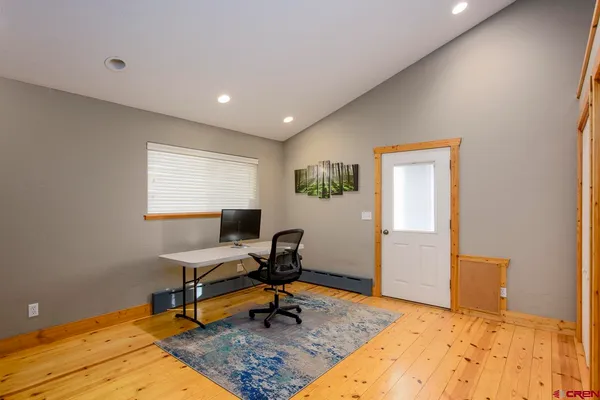 a workspace with furniture and a window