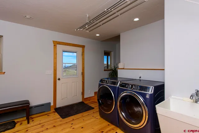 a view of a storage & utility room with washer and dryer