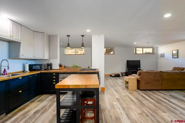 a kitchen with stainless steel appliances granite countertop a stove and a refrigerator