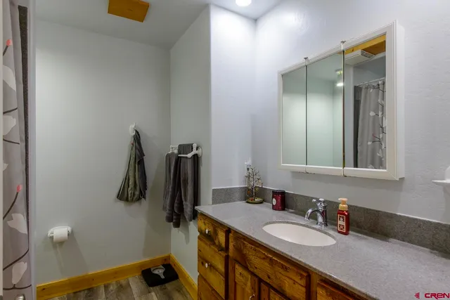 a bathroom with a sink double vanity and a mirror
