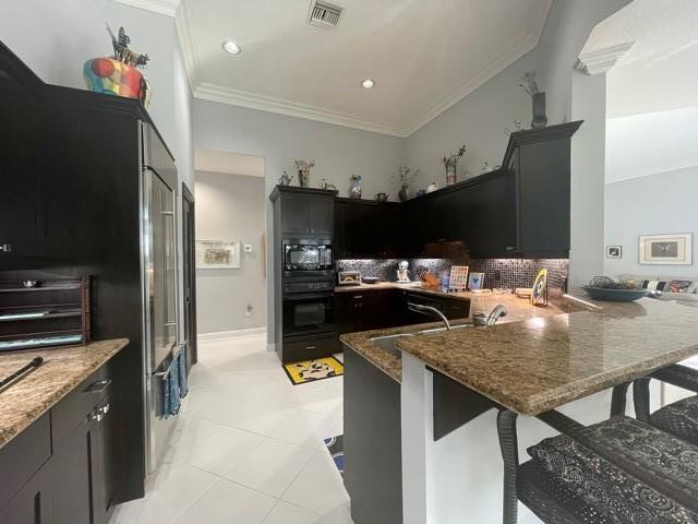 17581 Charnwood Drive Boca Raton, FL 33498 - Photo 14 of 40 Large kitchen with breakfast bar