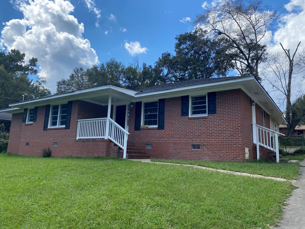 a front view of house with yard and green space