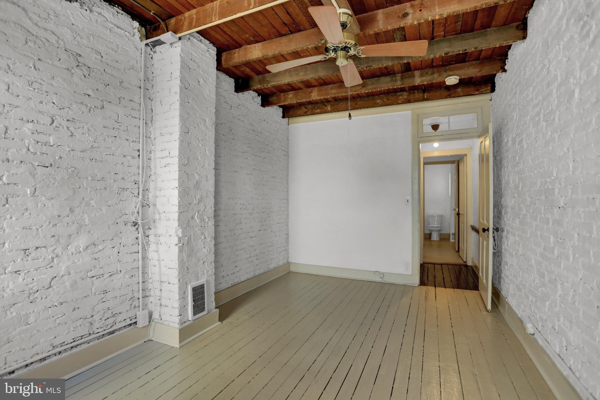 1306 Rutter Street Baltimore, MD 21217 - Photo 13 of 27 a view of a room with wooden floor