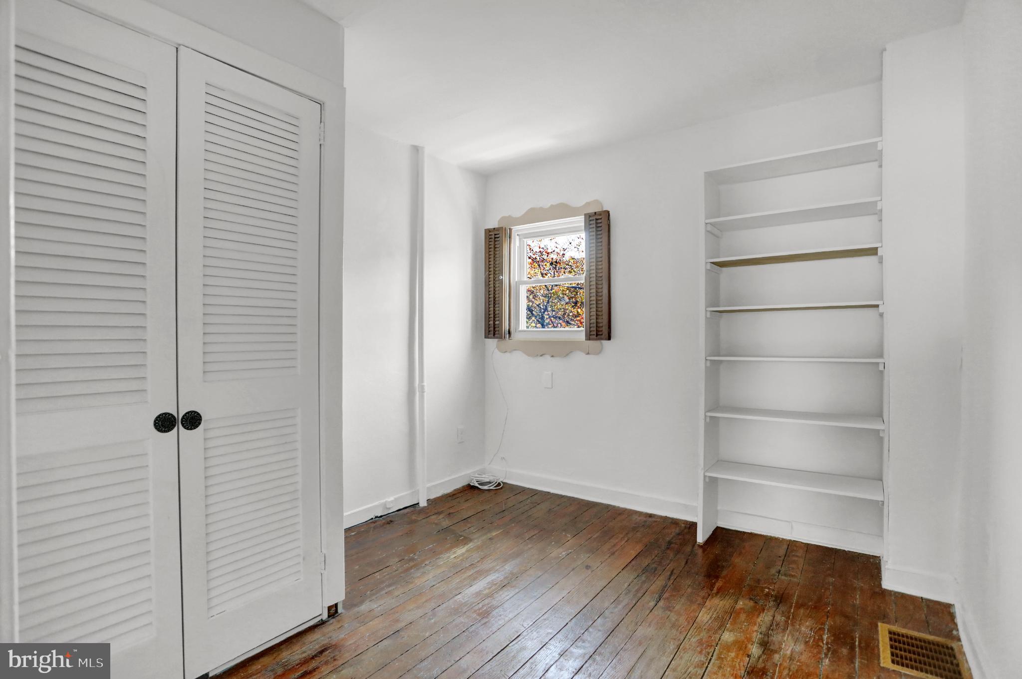 1306 Rutter Street Baltimore, MD 21217 - Photo 20 of 27 a view of walk in closet with empty racks
