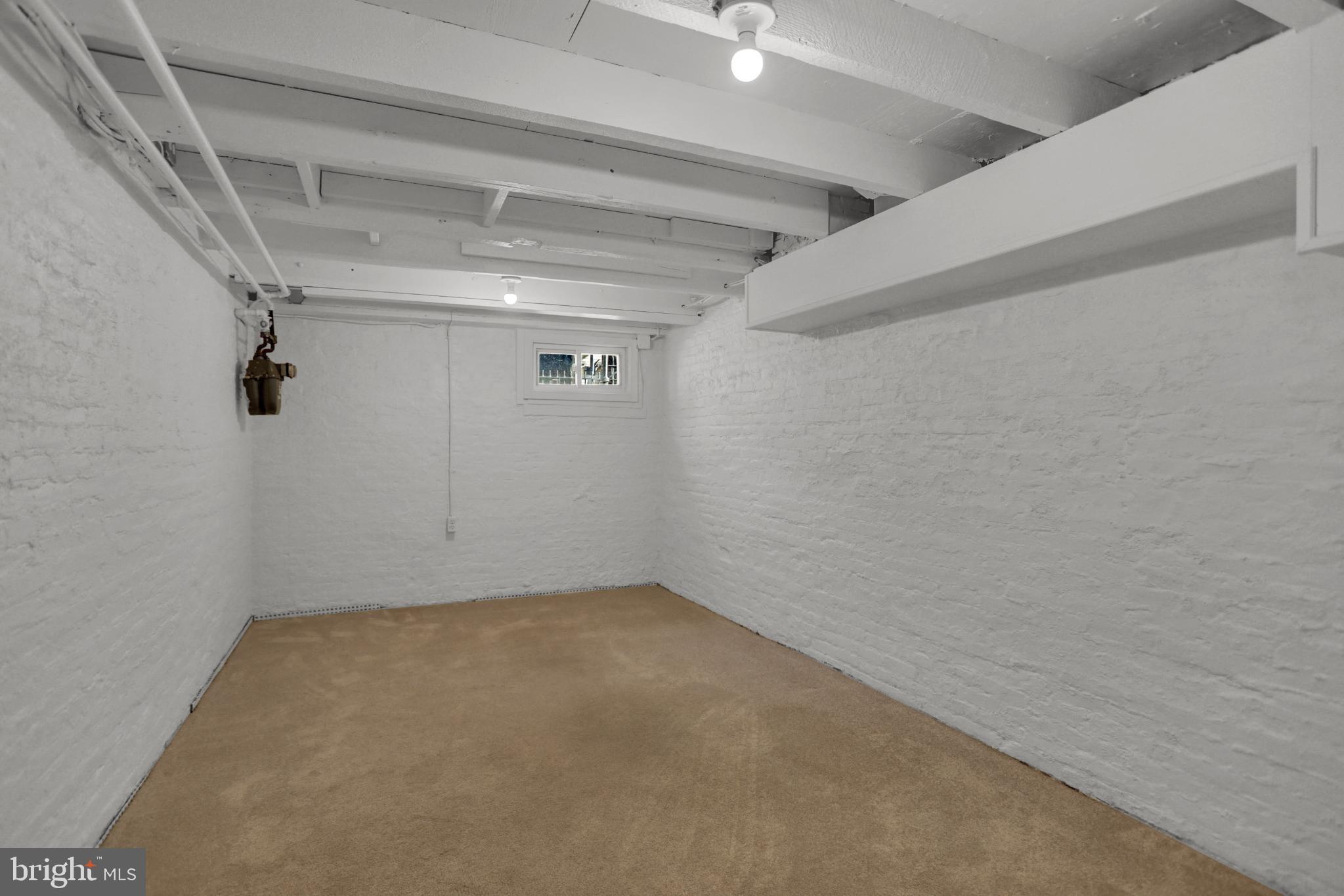 1306 Rutter Street Baltimore, MD 21217 - Photo 24 of 27 a view of a room with racks on the wall