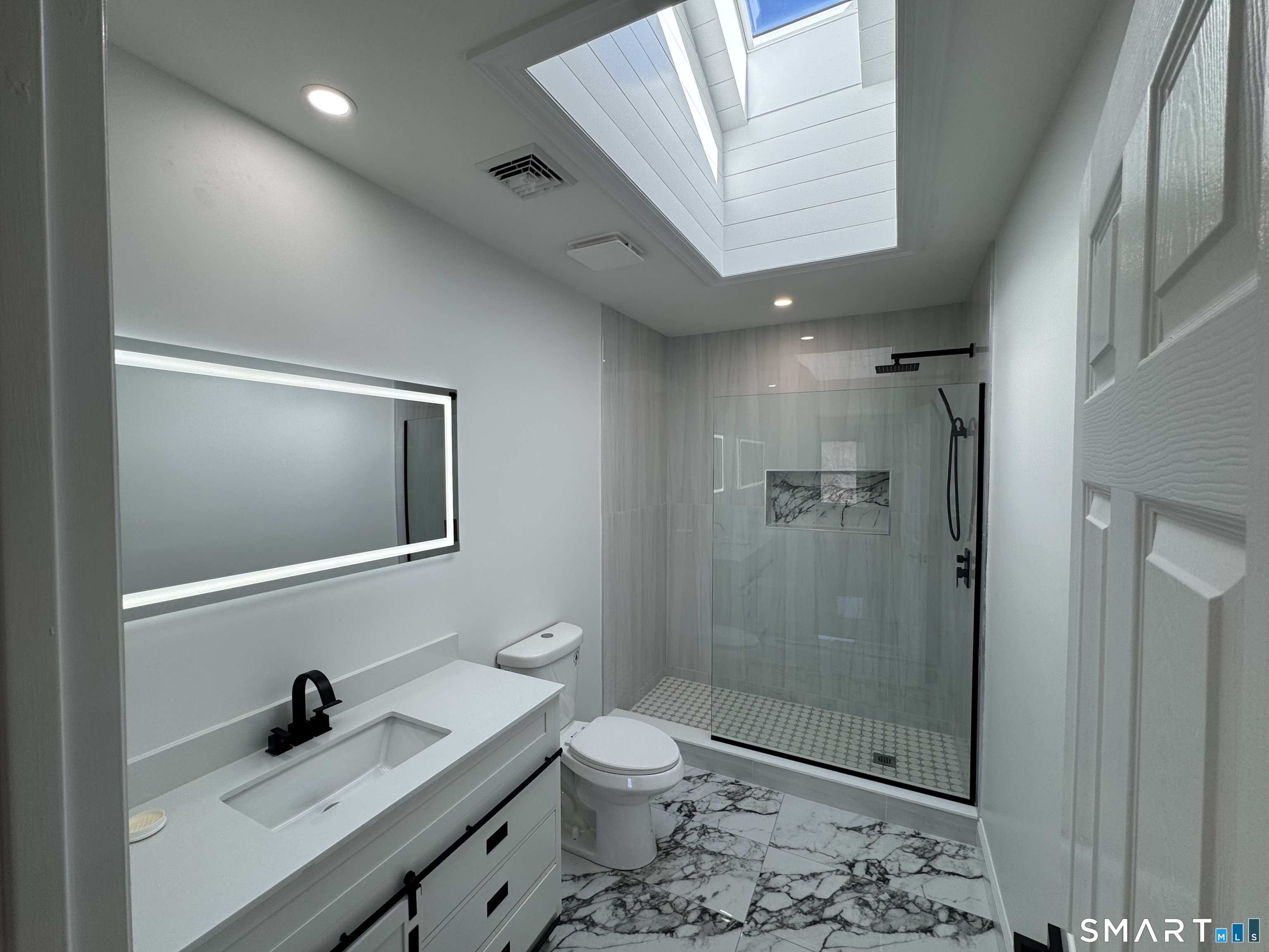 243 Long Hill Road Andover, CT 06232 - Photo 16 of 31 a bathroom with a sink a toilet and shower
