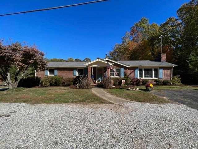 7338 Red House Road Appomattox, VA 24522 - Photo 1 of 28 a front view of a house with a yard