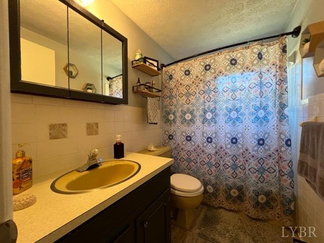 7338 Red House Road Appomattox, VA 24522 - Photo 12 of 28 a bathroom with a sink toilet and shower