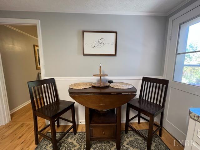 7338 Red House Road Appomattox, VA 24522 - Photo 7 of 28 a view of a dining room with furniture window and wooden floor
