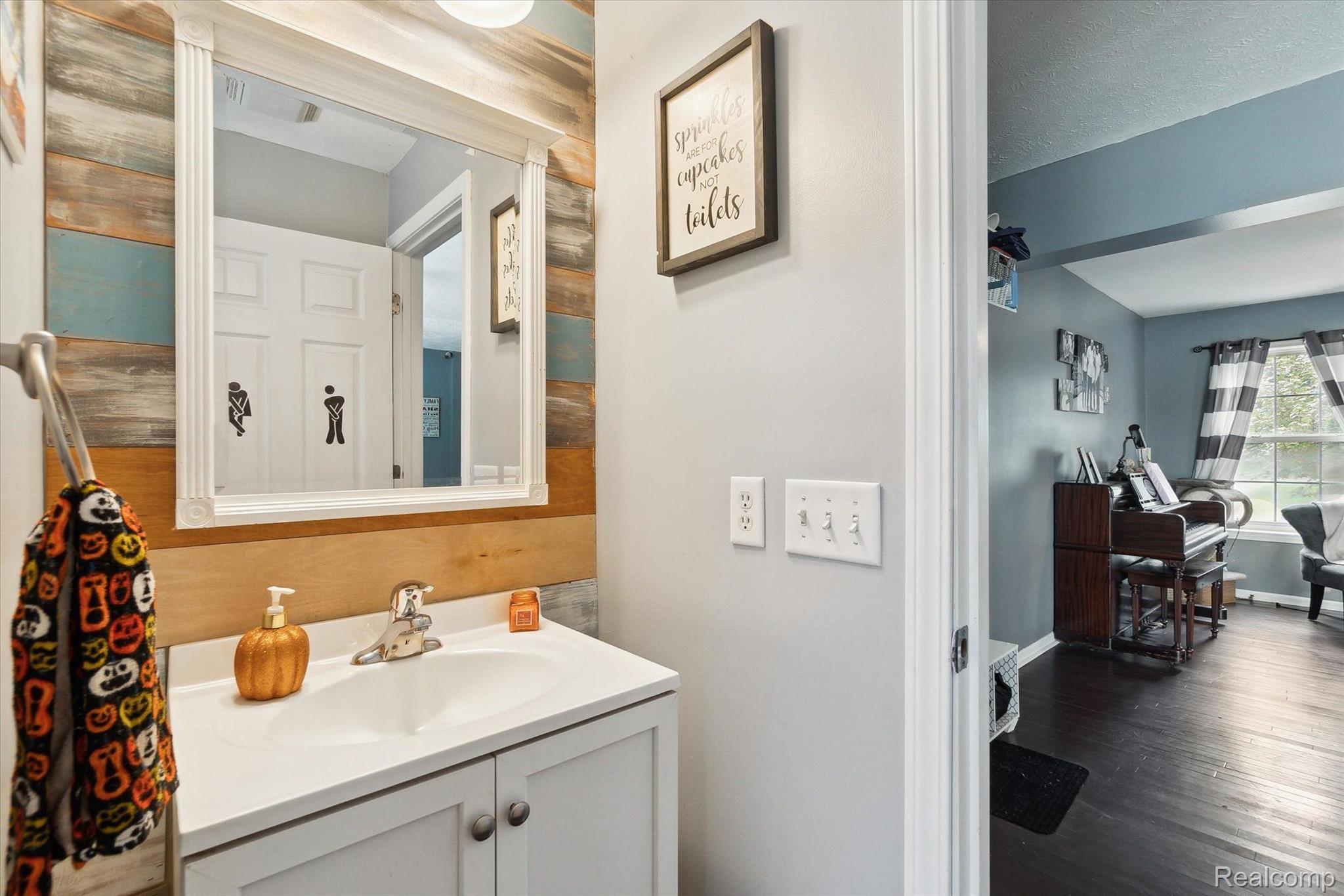 1855 Maxfield Lake Road Hartland, MI 48353 - Photo 16 of 42 Shiplap wall in powder room