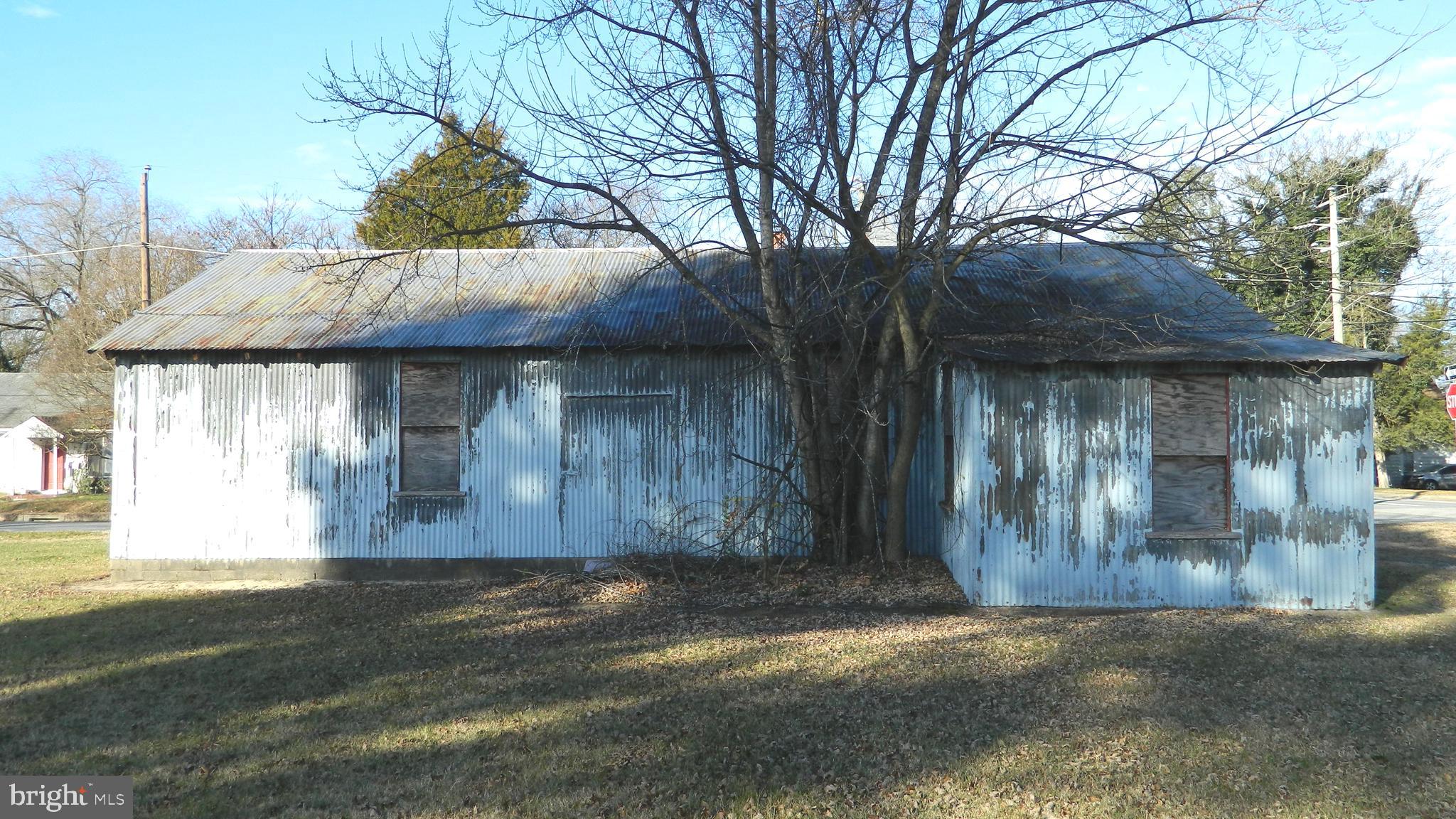 800 Gay Street Denton, MD 21629 - Photo 3 of 3 a front view of a house with a garden
