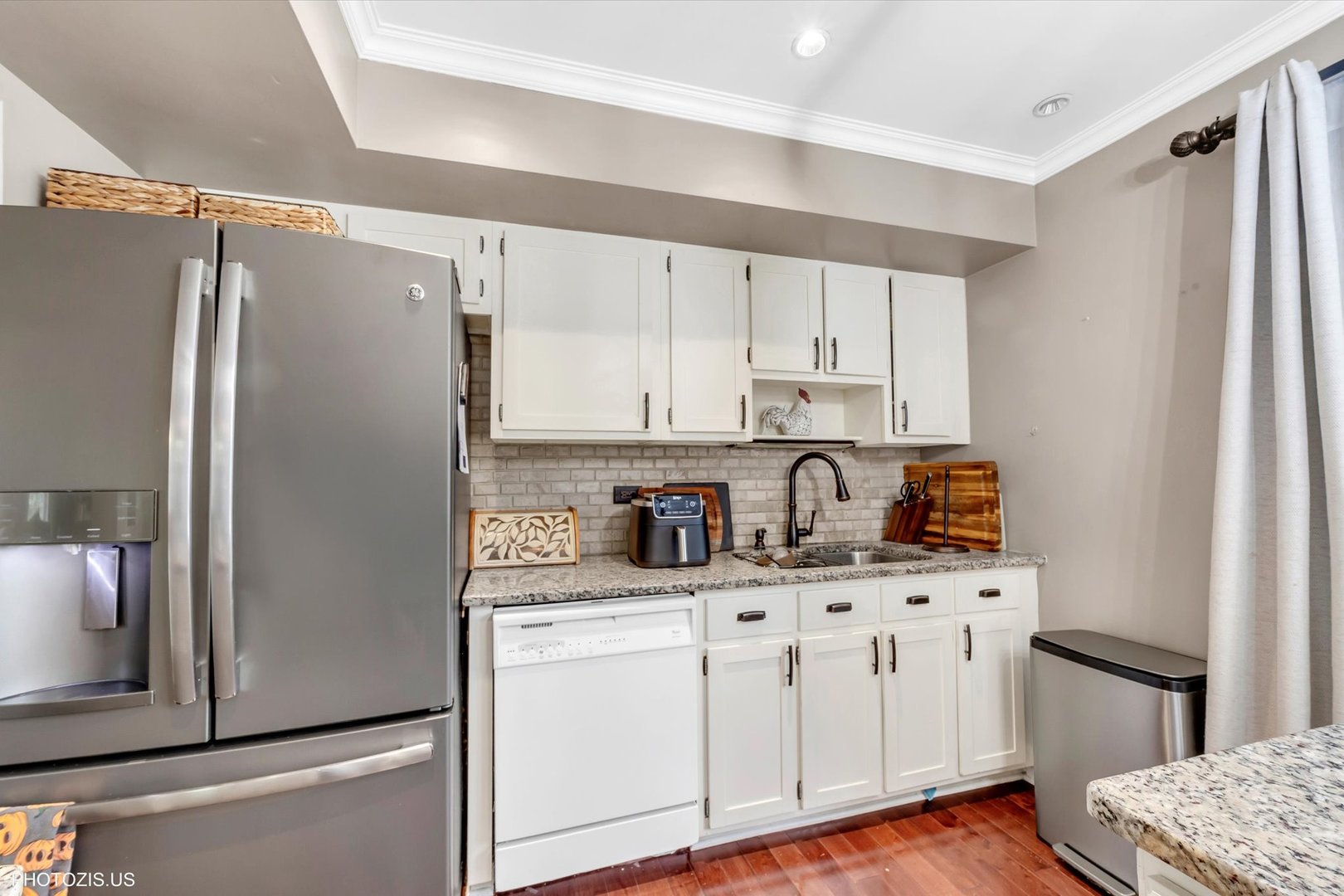 1352 West Oakmont Road Hoffman Estates, IL 60169 - Photo 25 of 42 a kitchen with stainless steel appliances a refrigerator sink and cabinets