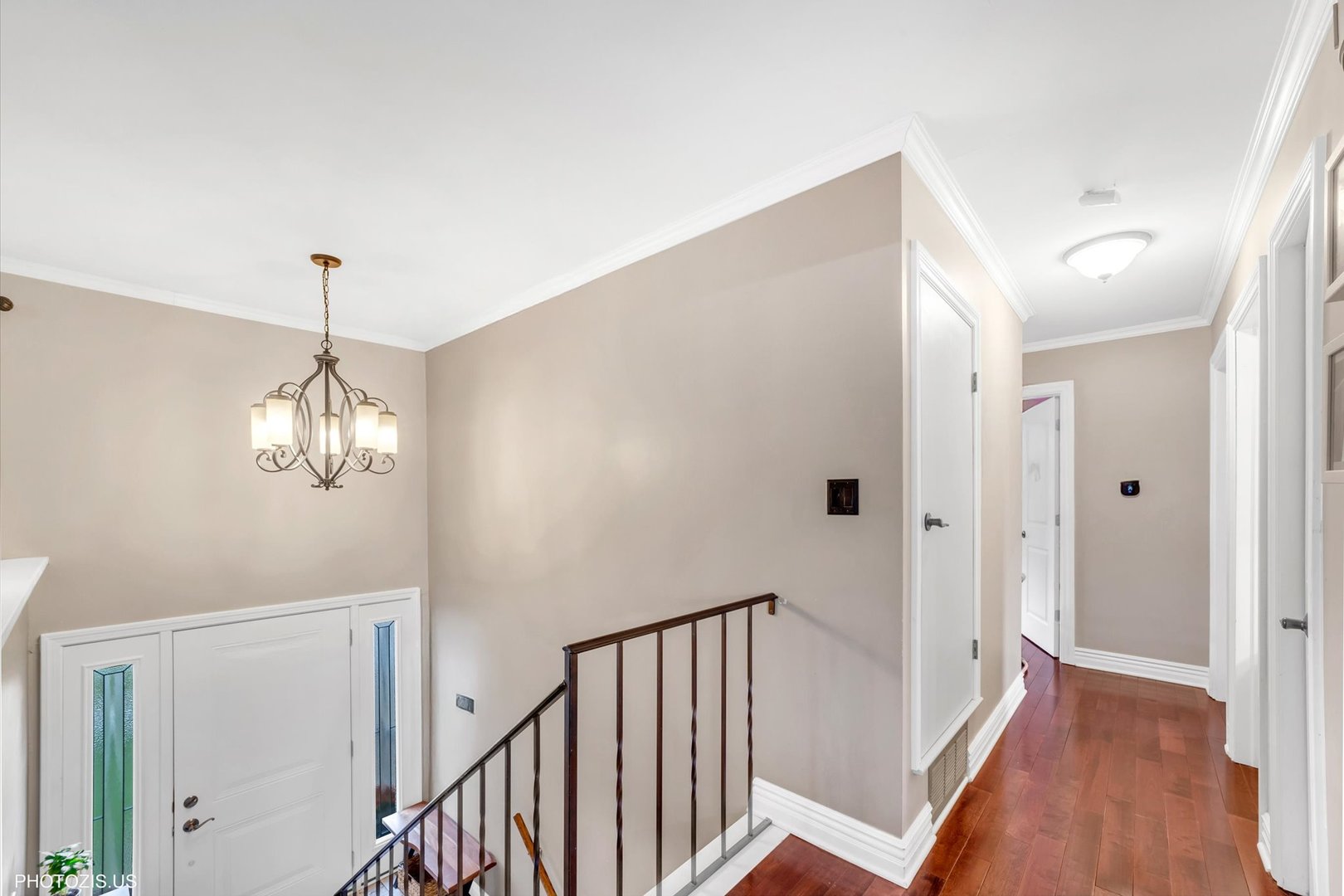 1352 West Oakmont Road Hoffman Estates, IL 60169 - Photo 26 of 42 a view of a hallway with wooden floor and stairs