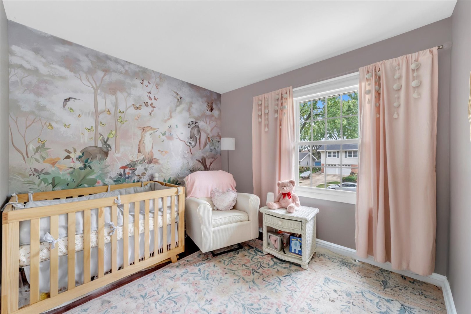 1352 West Oakmont Road Hoffman Estates, IL 60169 - Photo 30 of 42 a bedroom with a baby bed a couch and a window