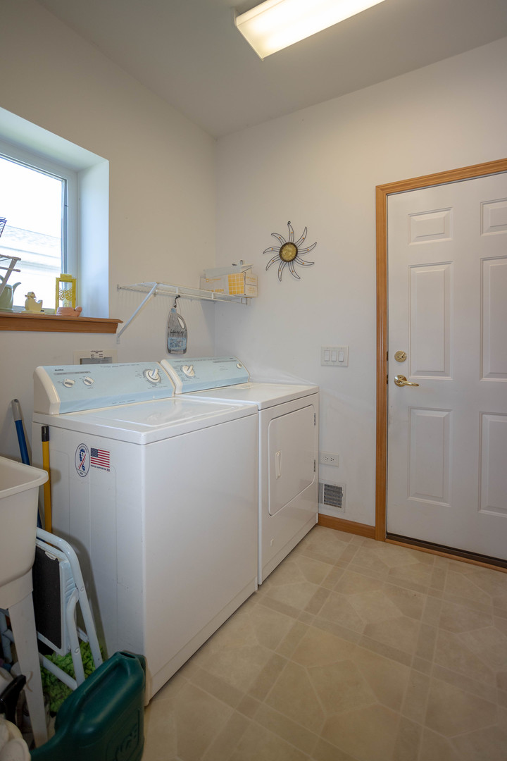 212 Rodeo Drive, Unit 2179 Grayslake, IL 60030 - Photo 31 of 31 a utility room with dryer and washer