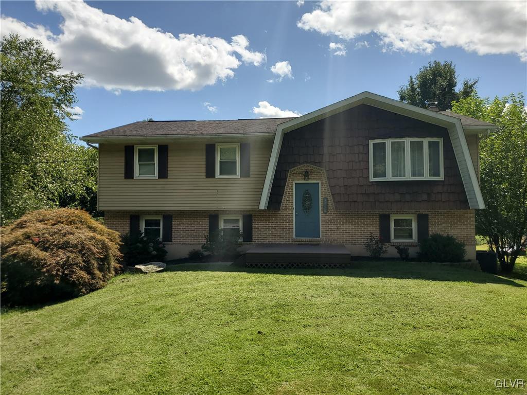 3556 Mountain Road Slatington, PA 18080 - Photo 1 of 31 a front view of a house with a yard