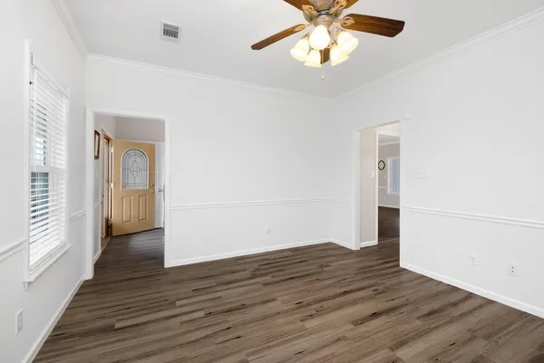 a kitchen with stainless steel appliances granite countertop a sink dishwasher stove and refrigerator with wooden floor